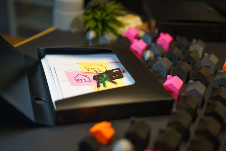 House keys and property documents on a desk
