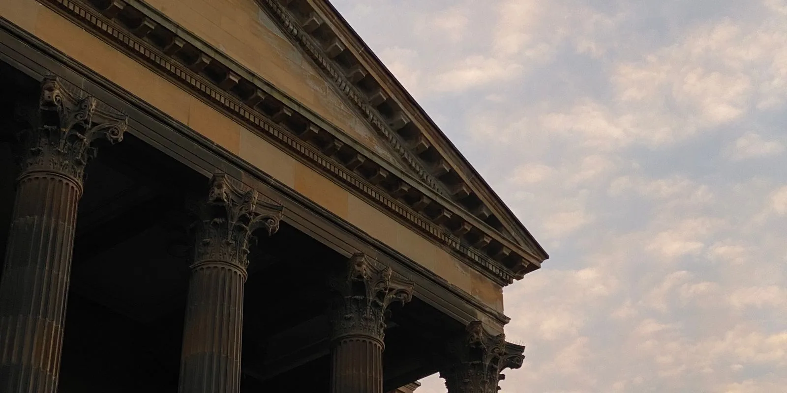 Columns of a Glasgow city centre office building at twilight