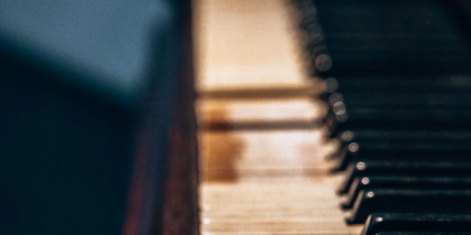 Close up of vintage piano keys and casework