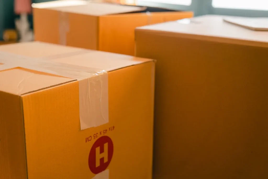 Cardboard boxes sealed with tape and stacked ready for storage