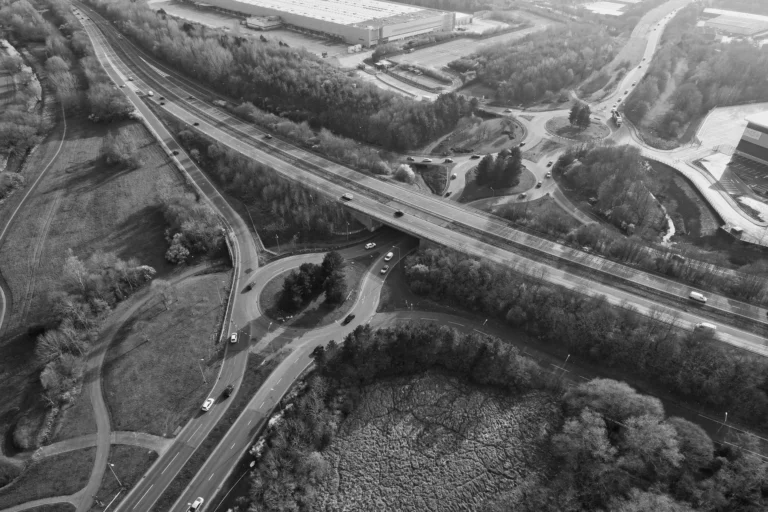 Aerial view of a motorway interchange and roundabouts in the English countryside