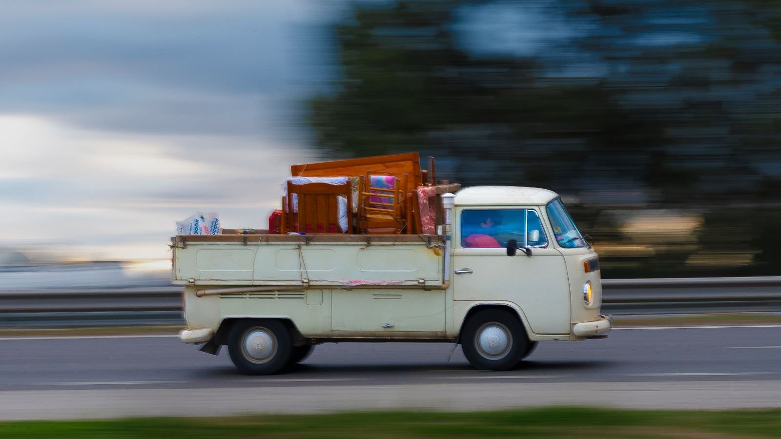 Van loaded with furniture on the road