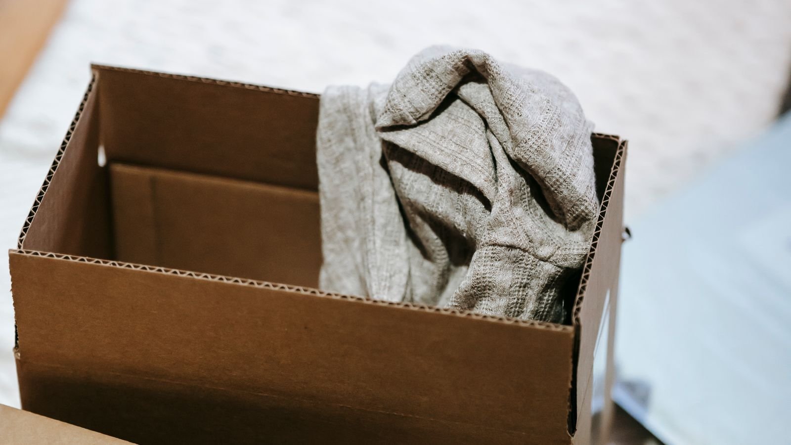 Cardboard boxes of belongings on a floor