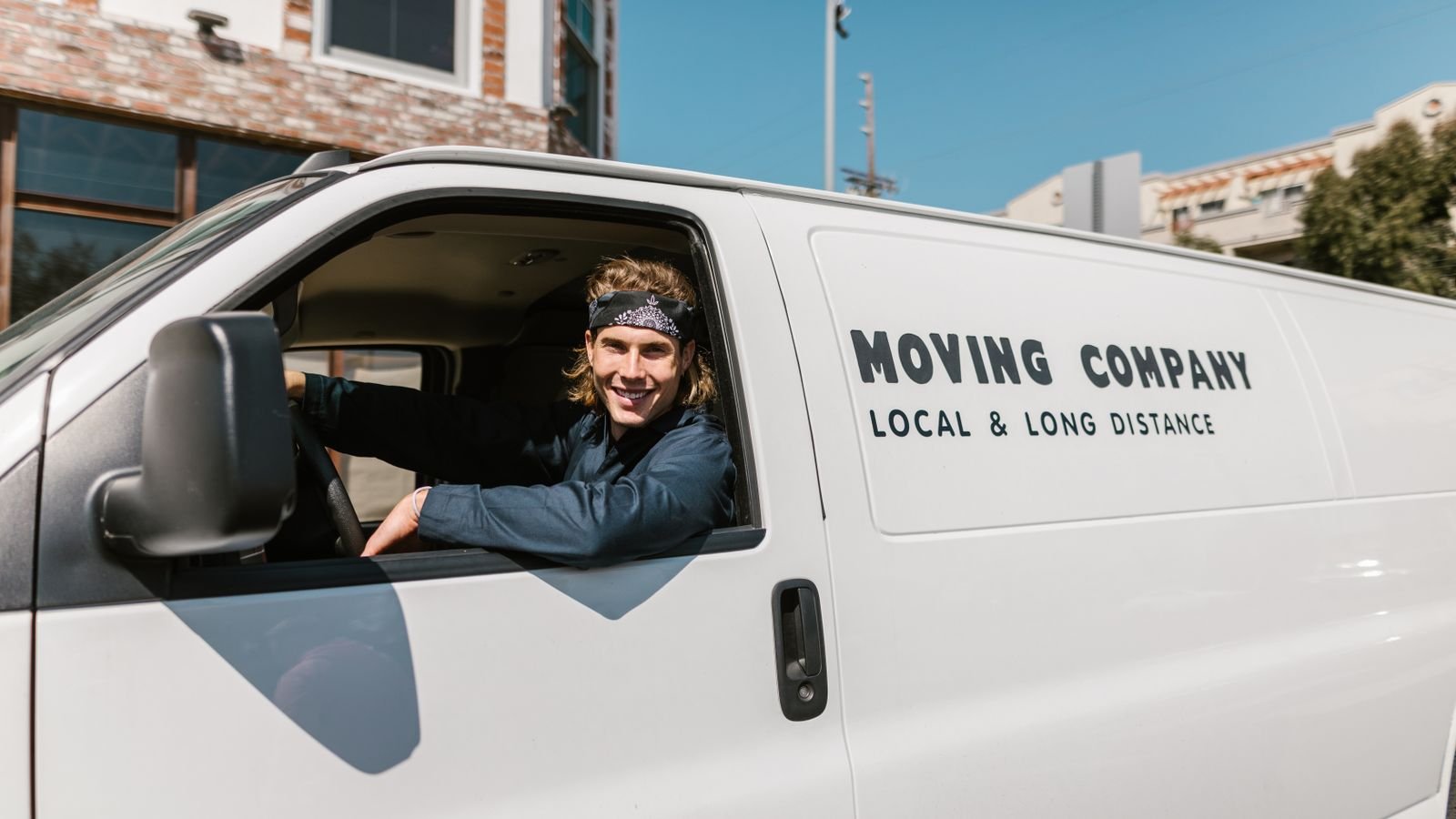Driver in the cab of a removals van